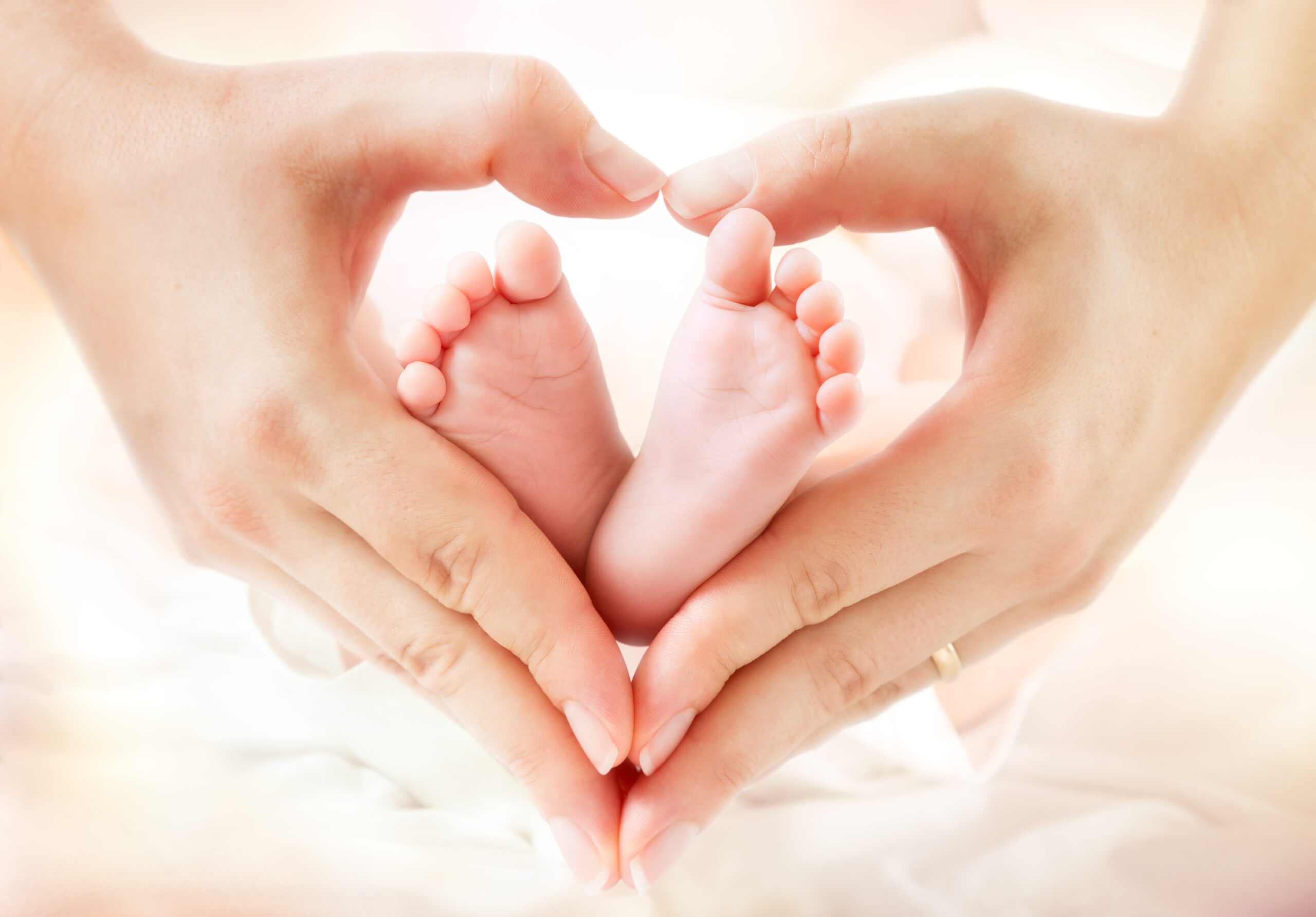 AdobeStock_88064085 heart with baby feet