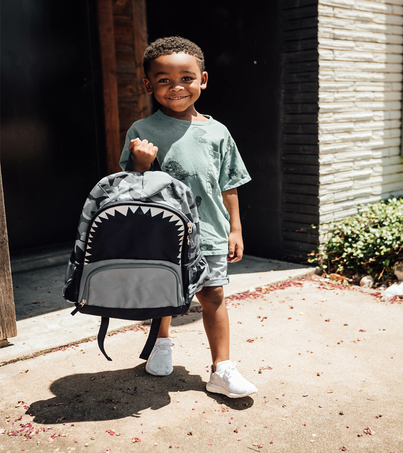 Kid holding Backpack